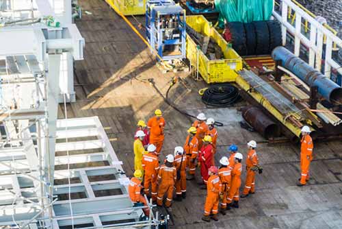 Group of worker wearing high visibility workwear 